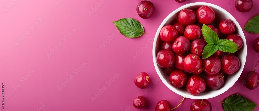A pink backdrop hosts a bowl of cherries, encircled by their lush green leaves Inscribe 'Cherries' centrally A pink backdrop hosts a bowl of cherries, encircled by their lush green leaves Inscribe 'Cherries' centrally