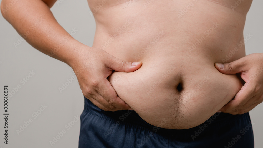 Overweight or obese man on white background. Fat mens body measurements. he is dieting and losing weight. Healthcare, medicine concept. he is dieting and losing weight. Overweight or obese man on white background. Fat mens body measurements. he is dieting and losing weight. Healthcare, medicine concept. he is dieting and losing weight.