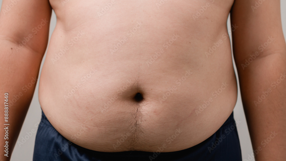 Overweight or obese man on white background. Fat mens body measurements. he is dieting and losing weight. Healthcare, medicine concept. he is dieting and losing weight. Overweight or obese man on white background. Fat mens body measurements. he is dieting and losing weight. Healthcare, medicine concept. he is dieting and losing weight.