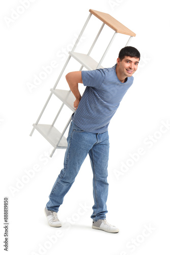 Young man carrying shelf un...