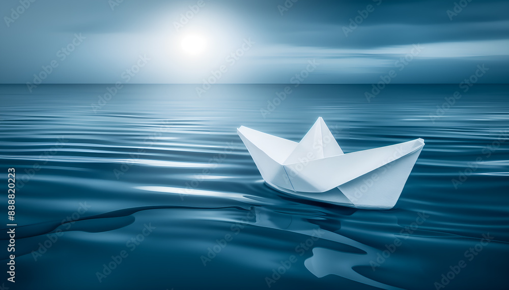 Obraz premium paper boat on blue water
