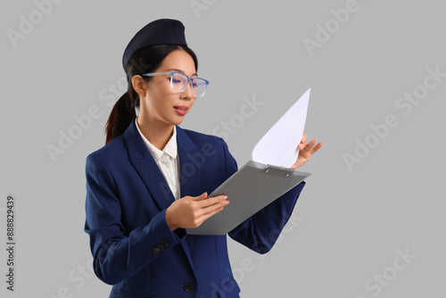 Young Asian stewardess with...