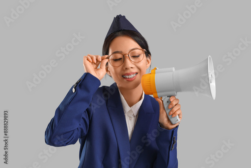 Young Asian stewardess with...