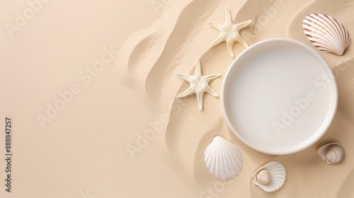 Fototapeta Naklejka Na Ścianę i Meble -  Chic beige podium with sea shell and starfish for cosmetic display on sandy beach backdrop.