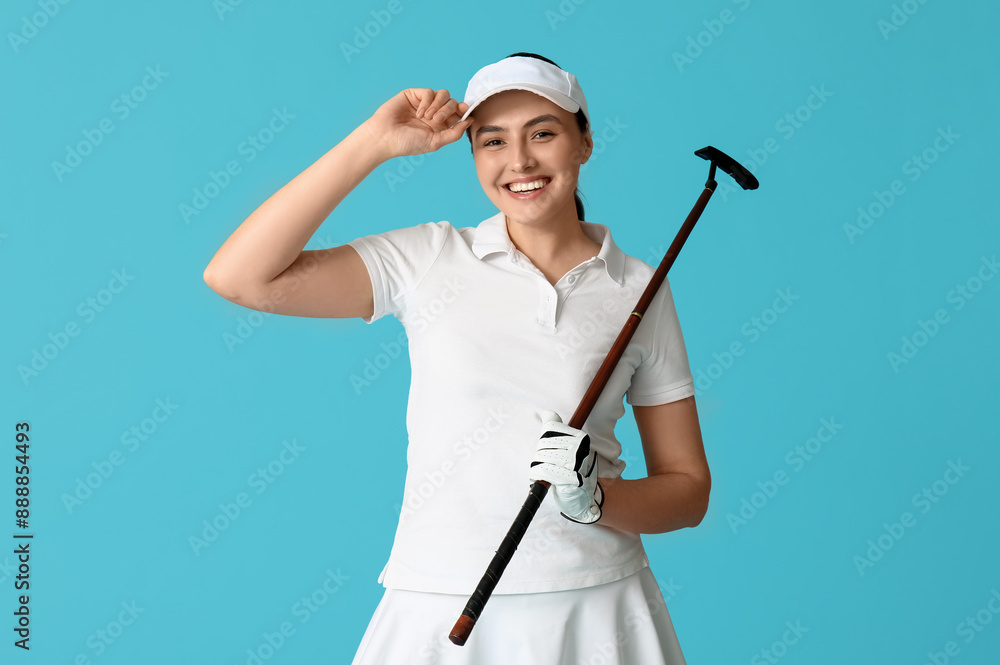 Beautiful female golfer on blue background Beautiful female golfer on blue background