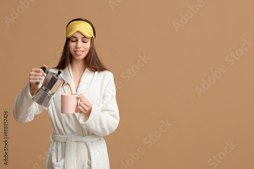 Young woman in bathrobe and...