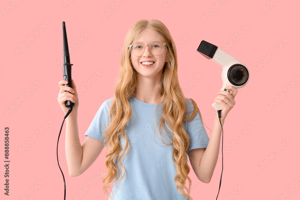 Beautiful young happy woman with curling iron and hairdryer on pink background Beautiful young happy woman with curling iron and hairdryer on pink background