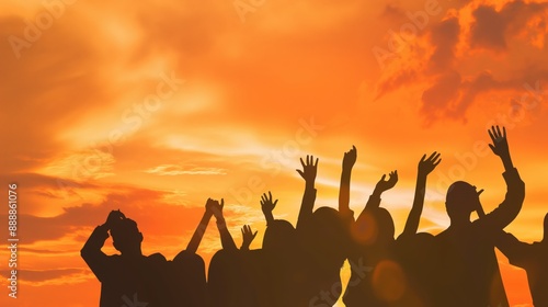 Silhouette upper body group of teens raised hand or hands up celebration on sunset orange sky.