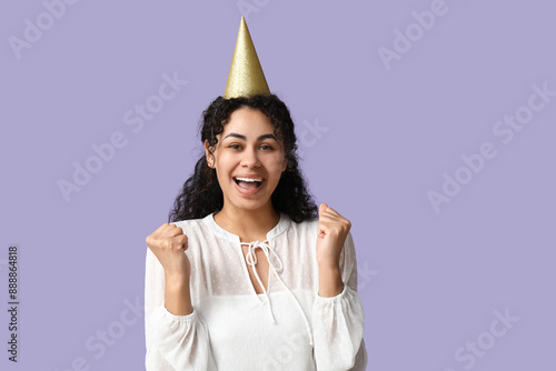 Excited young woman celebra...