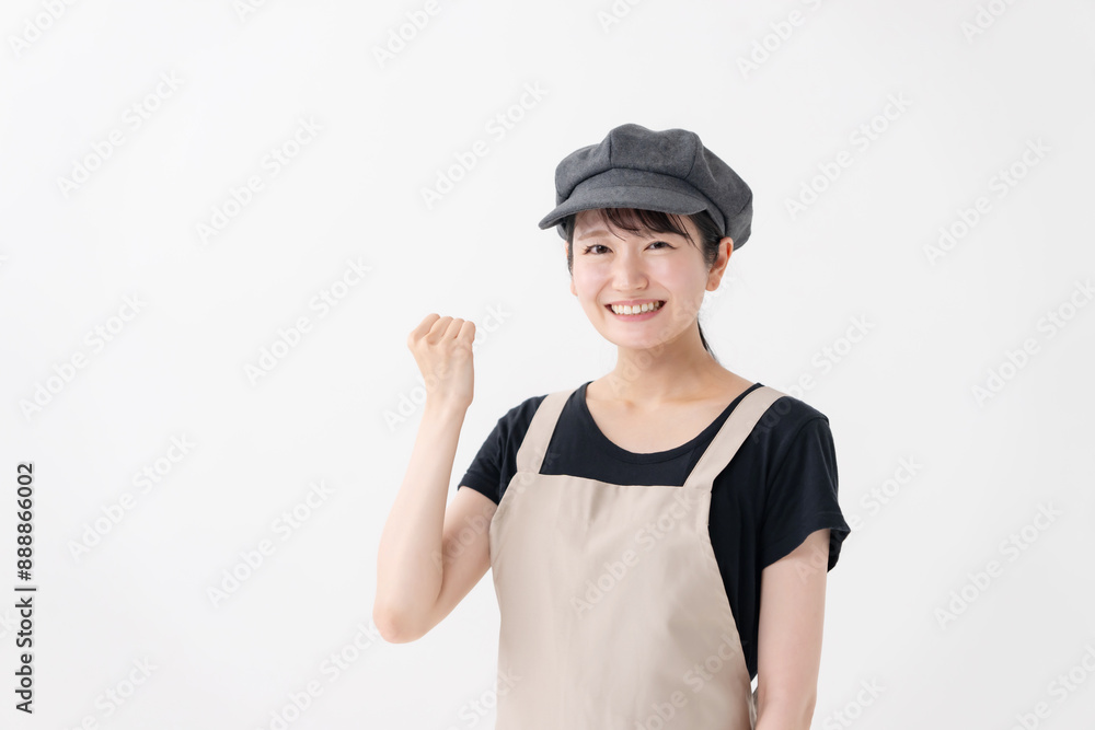 ガッツポーズする飲食業女性 ガッツポーズする飲食業女性