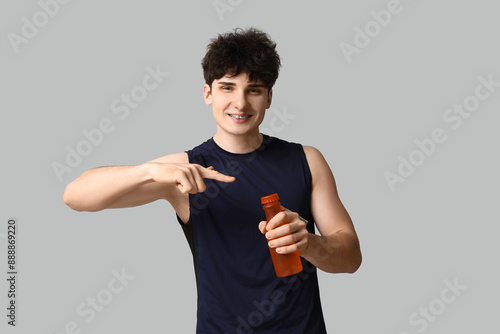 Smiling young man with brac...