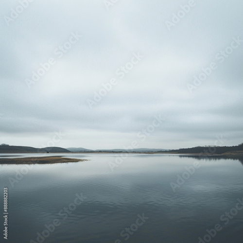 view of a lake  overcast sky  sparse clouds  symmetrical  photography