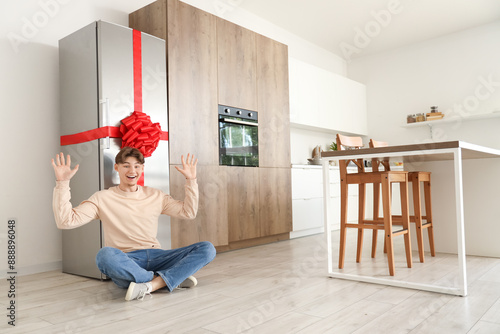 Happy young man with gift f...