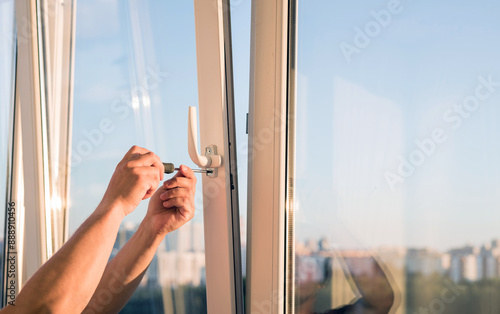 hands adjust the plastic window