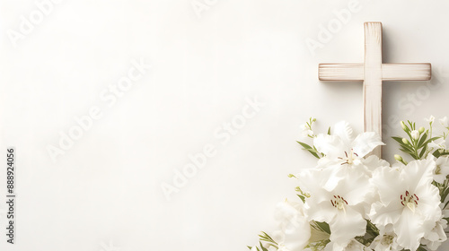 Composition with a Christian wooden cross and flowers against muted white background with space for text. Funeral invitation template