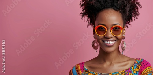 Smiling Woman Wearing Colorful Sunglasses and Earrings Against Pink Background