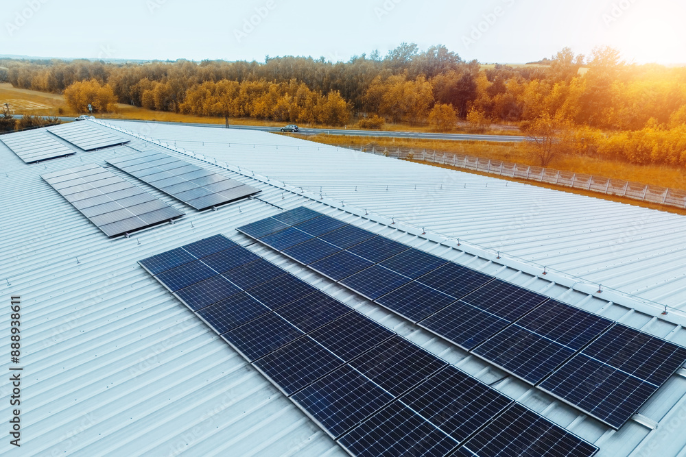 Large roof with solar panels in rural green landscape