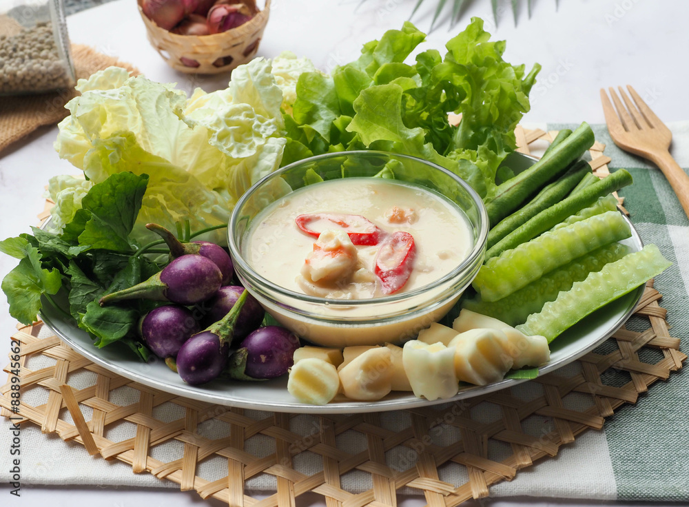 Thai style shrimp simmered in coconut milk with chili and fresh vegetables - Thai food called Lon Kung or Lhon kung at close up view Thai style shrimp simmered in coconut milk with chili and fresh vegetables - Thai food called Lon Kung or Lhon kung at close up view