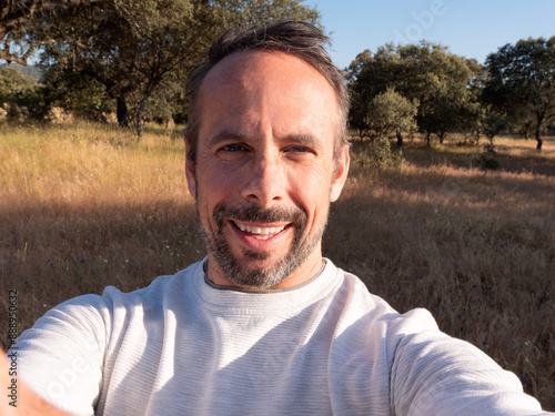 Man Taking Selfie in Sunny Countryside Landscape