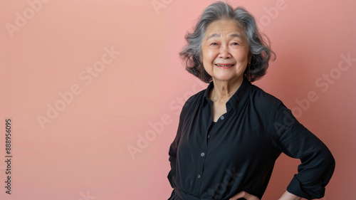 Elderly Asian woman hands on hips smiling confiden 4 1 woman, beauty, face, smile, smiling, person, business, lady, hair, people, blonde, model, businesswoman, blond, eyes, mature, looking, fashion, h photo