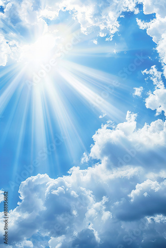 Bright Sunlight Streaming Through Fluffy Clouds in a Clear Blue Sky - Radiant Sunbeams and Soft Clouds Creating a Heavenly Landscape