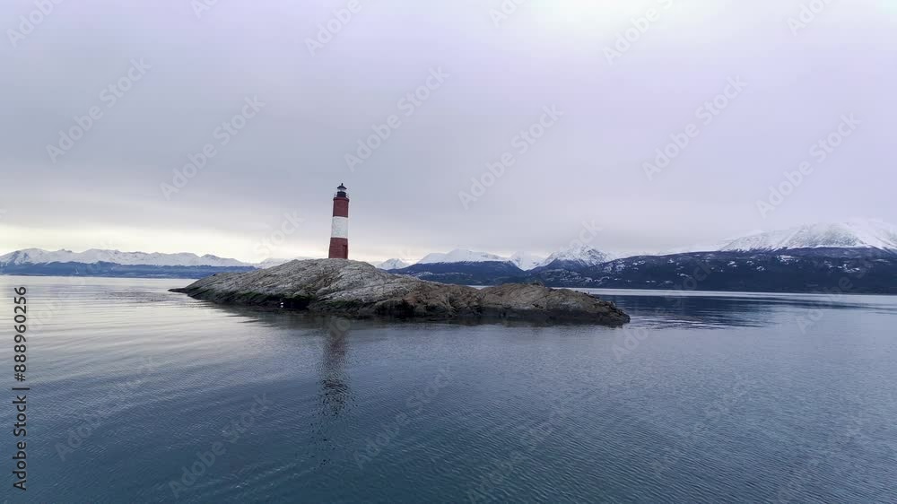 Sunset Ushuaia Lighthouse At Ushuaia Tierra Del Fuego Argentina. Birds Eye View Of Lighthouse Standing Tall Against The Blue Sky. Outdoor Travel Destinations Patagonia Sundown. Sunset Ushuaia Lighthouse At Ushuaia Tierra Del Fuego Argentina. Birds Eye View Of Lighthouse Standing Tall Against The Blue Sky. Outdoor Travel Destinations Patagonia Sundown.