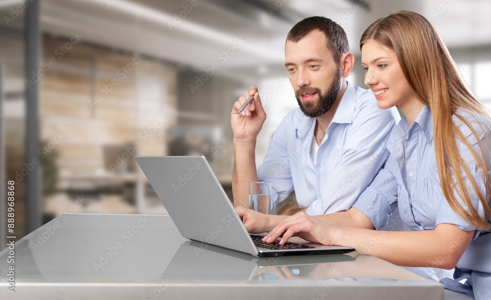 Busy professional people working on laptop in office Busy professional people working on laptop in office