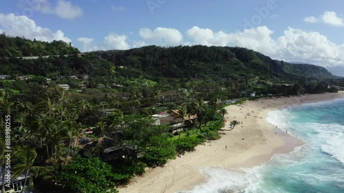 Drone shot of the buildings lining Hawaii's Sunset Beach on a sunny day. photo