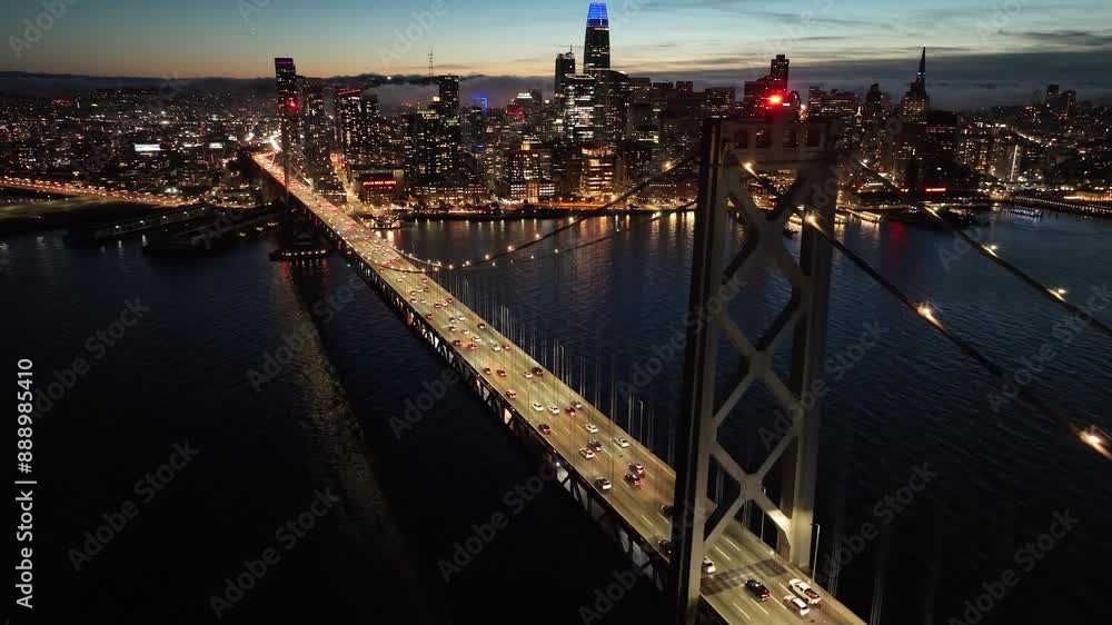 Sunset Oakland Bay Bridge At San Francisco California United States. Iconic Structure Of Bridge Connecting Landmarks Streets. Building Town Clouds Sky Illumination Urban. Sunset Oakland Bay Bridge At San Francisco California United States. Iconic Structure Of Bridge Connecting Landmarks Streets. Building Town Clouds Sky Illumination Urban.