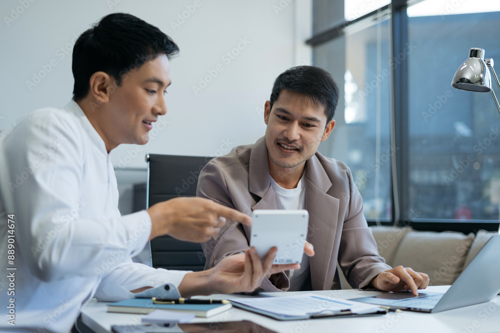 Business team working on a project in the office or reviewing and discussing a business project. Business team working on a project in the office or reviewing and discussing a business project.
