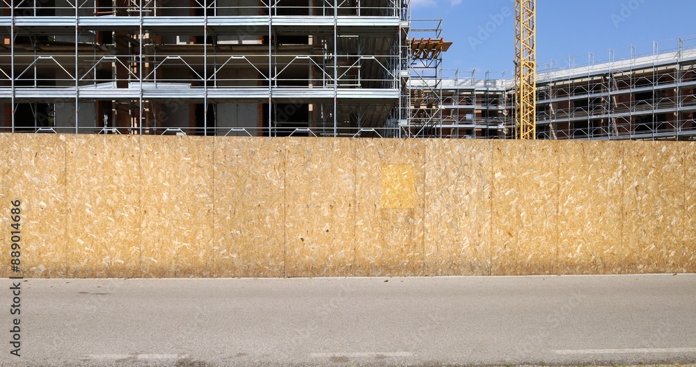 custom made wallpaper toronto digitalOriented stranded board barrier with large building under construction behind. Street in front. Background for copy space.