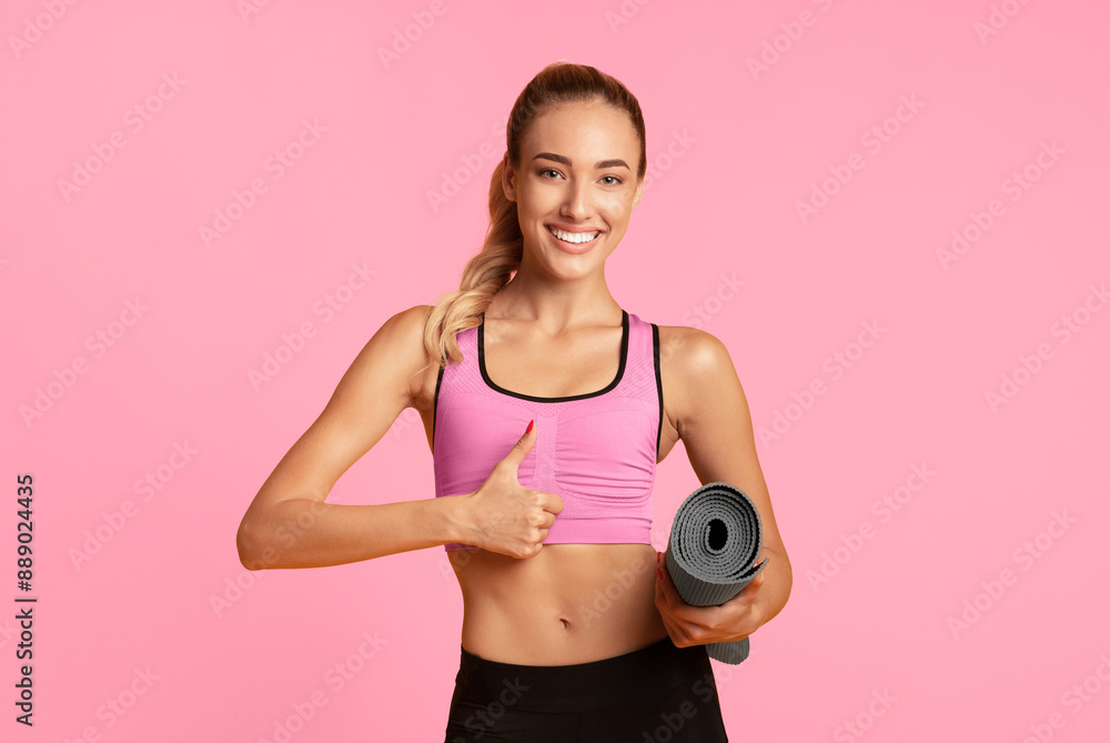 Like. Young Lady Holding Fitness Mat Gesturing Thumbs-Up Over Yellow Background. Studio Shot Like. Young Lady Holding Fitness Mat Gesturing Thumbs-Up Over Yellow Background. Studio Shot