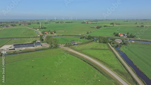 Aerial view of rural landscape with farm, cows, and river, Allingawier, Friesland, Netherlands. photo