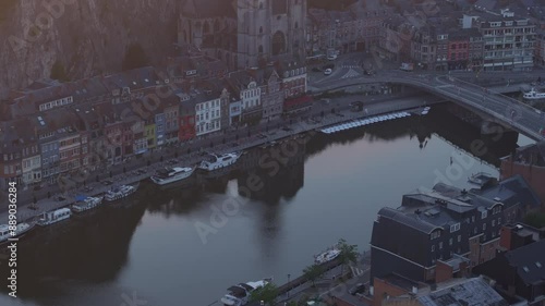 Aerial view of historic city with river, boat, bridge, church, citadel, and buildings, dinant, belgium. photo