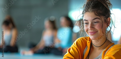 Young Woman Using Smartphone During Yoga Class in Modern Studio