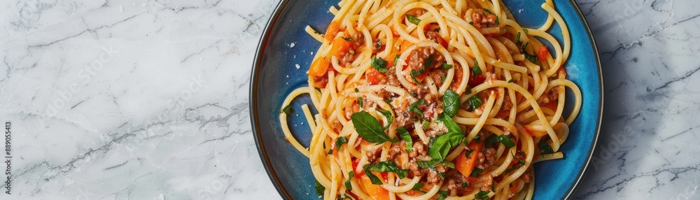 A plate of spaghetti with meat and cheese on top. The plate is blue and the food is arranged in a way that makes it look appetizing A plate of spaghetti with meat and cheese on top. The plate is blue and the food is arranged in a way that makes it look appetizing
