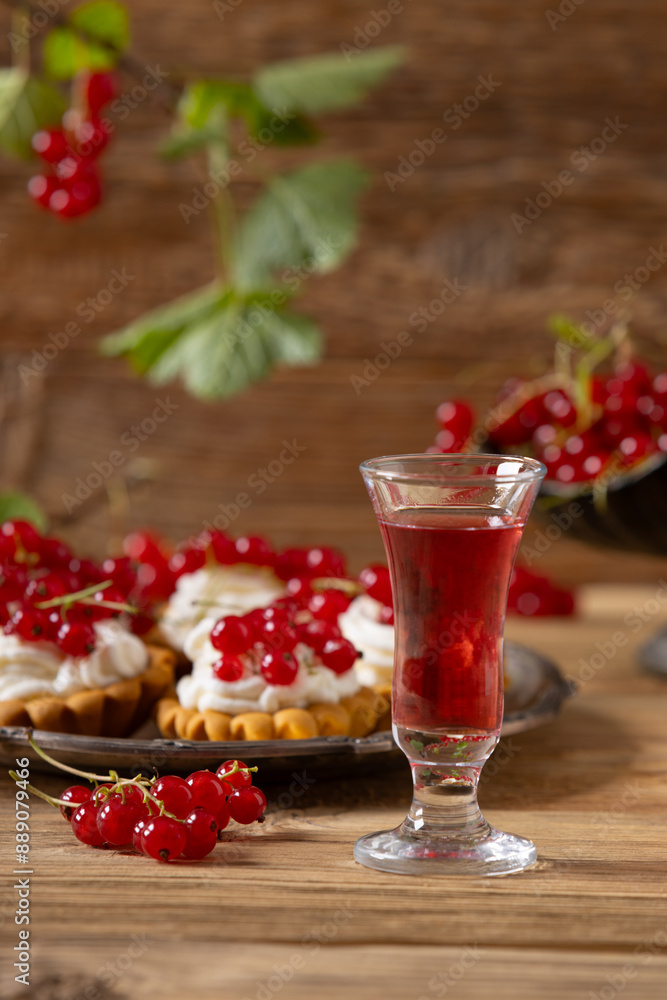 Delicious homemade currant liqueur. Served in a glass and carafe. Served with currant cake. Delicious homemade currant liqueur. Served in a glass and carafe. Served with currant cake.