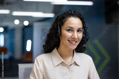 Friendly customer service representative with headset smiling in modern office . Professional environment technology and support concept. Ideal for business  communication  and customer support