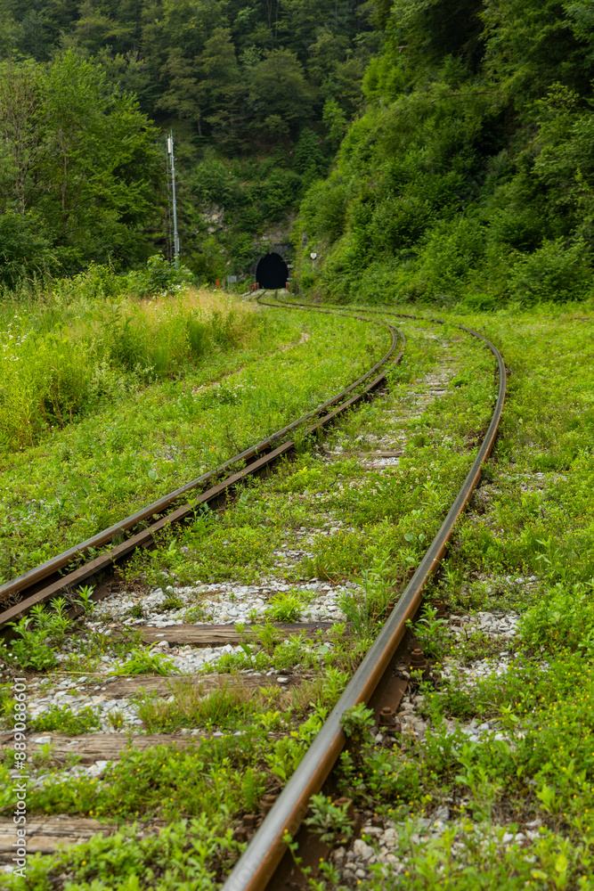 Railroad tracks, tunnel with train tracks, railway signs, ancient railway crossing, vintage train, curved lines. Railroad tracks, tunnel with train tracks, railway signs, ancient railway crossing, vintage train, curved lines.