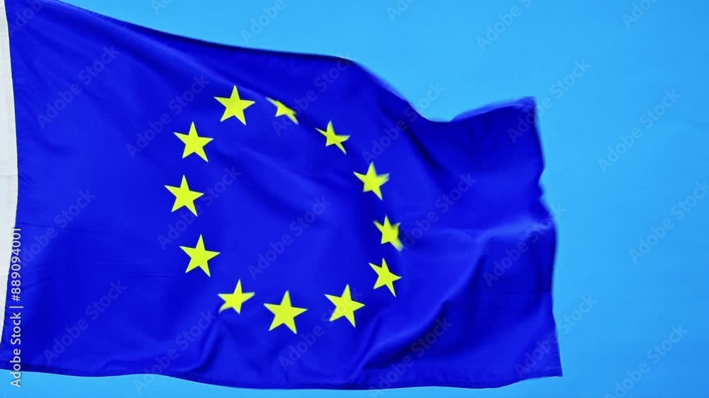 Slow motion video of European Union flag waving on blue background Slow motion video of European Union flag waving on blue background