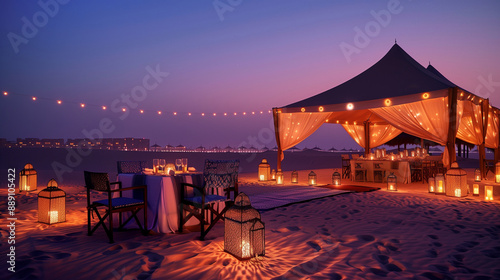 A romantic candlelit dinner setup on the beach, with an intricate tent and tables set up under a twilight sky, overlooking endless sand dunes at Dubai's most luxurious hotel resort