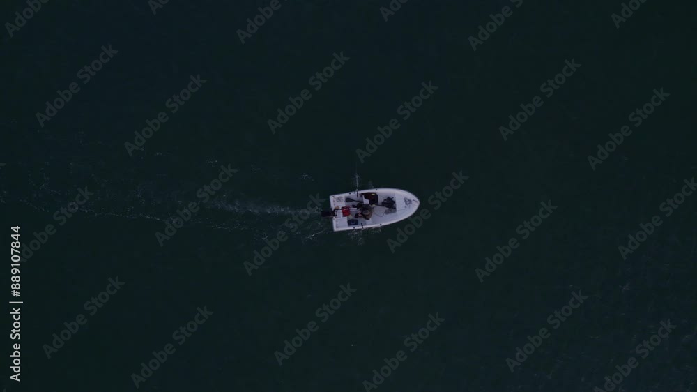 Aerial view of fishing boat in ocean at sunrise, Albufeira, Faro, Portugal. Aerial view of fishing boat in ocean at sunrise, Albufeira, Faro, Portugal.