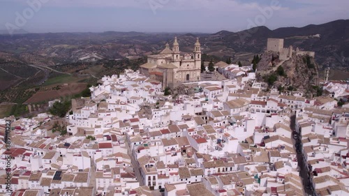 Aerial view of historic town with white church, castle, and famous whitewashed houses, Olvera, Andalusia, Spain. photo