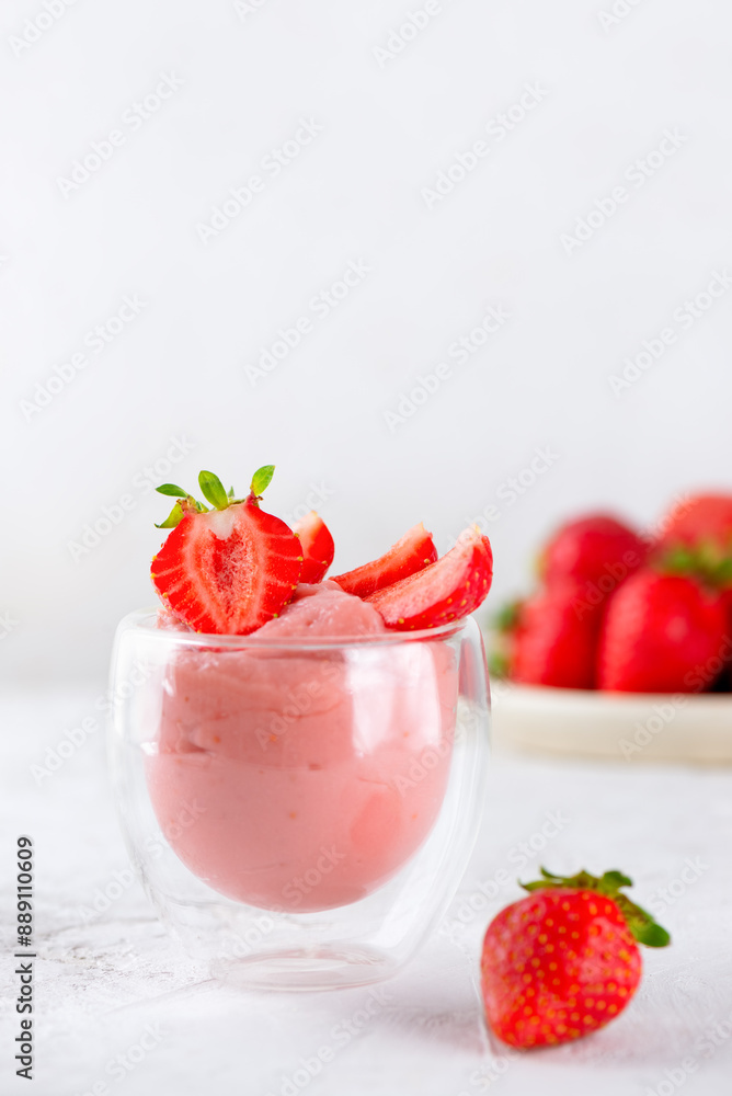 Tofu soy dessert with strawberry in a glass. Lactose and sugar free. Vertical orientation. Tofu soy dessert with strawberry in a glass. Lactose and sugar free. Vertical orientation.