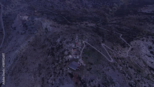 Aerial view of El Torcal nature reserve with rocky mountain terrain and winding road, Malaga, Spain.