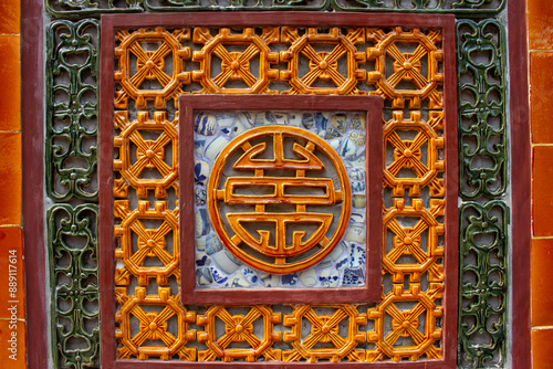 Detail Of Ceramic Mosaic On The Wall Of A Palace In Hue Imperial Citadel. Hue Imperial Citadel, A UNESCO Cultural Heritage Is A Major Tourist Destination In Vietnam.