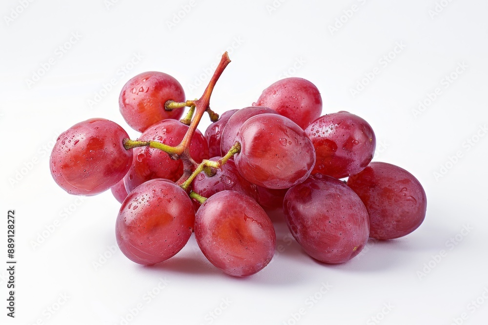 A neatly arranged bunch of plump, whole red grapes against a crisp white background. A neatly arranged bunch of plump, whole red grapes against a crisp white background.
