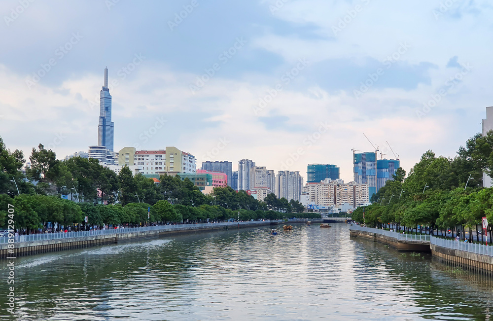 Fototapeta premium View Of Nhieu Loc - Thi Nghe Channel With Buildings And Skyscraper In Ho Chi Minh City, Vietnam.
