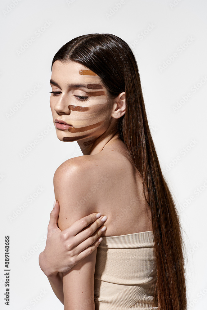 Refined woman showcases her beauty with makeup on her face, including foundation. Refined woman showcases her beauty with makeup on her face, including foundation.
