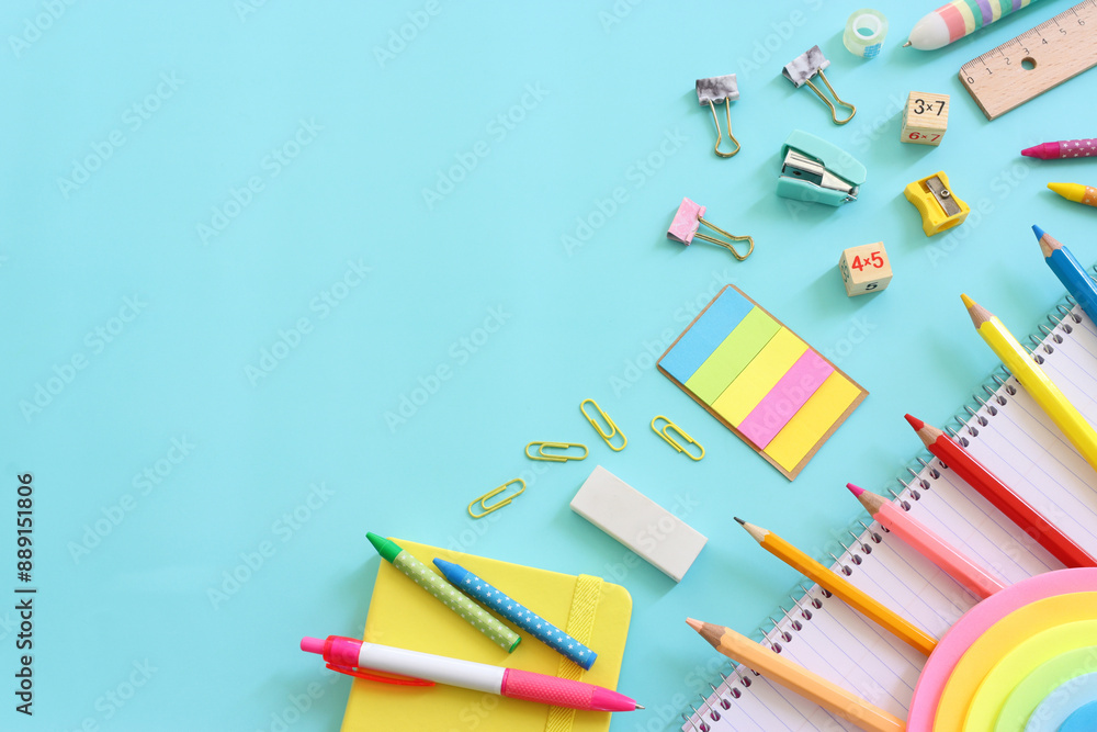 Fototapeta premium education and back to school concept. stationery over blue background. top view, flat lay